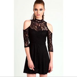 Short black lace dress.
